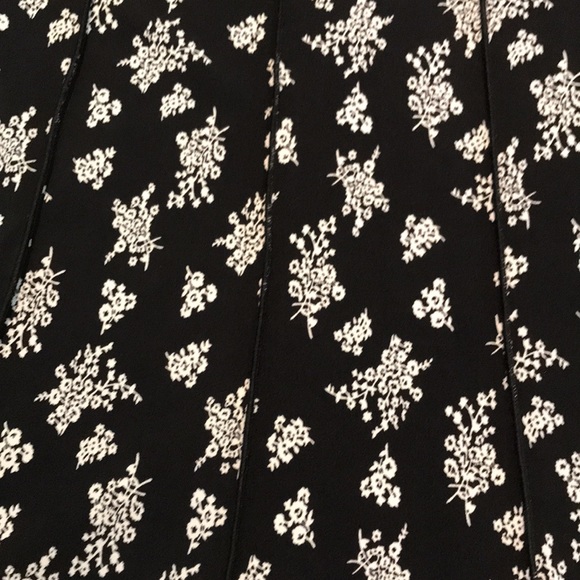 Flattering black and white flowy dress with double flap v neck collar. - Picture 7 of 15